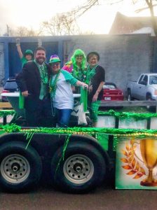 Group on the St. Patrick's Day float dressed in green.