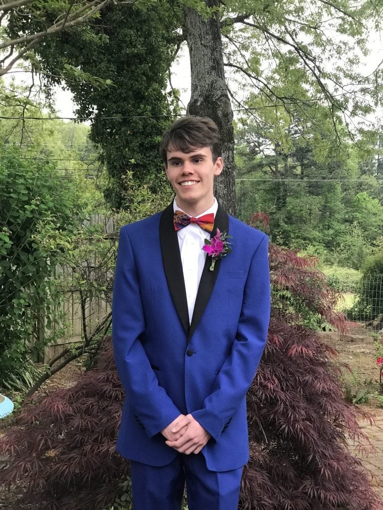Noah's Senior Prom - he's in a royal blue tux in our backyard.