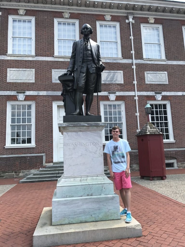 www.redneckrhapsody Noah posing with George Washington in front of Independence Hall.