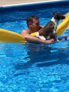 www.redneckrhapsody.com Cabana Boy (Wayne) & Chance our best swimming dog in the pool floating on an air raft.