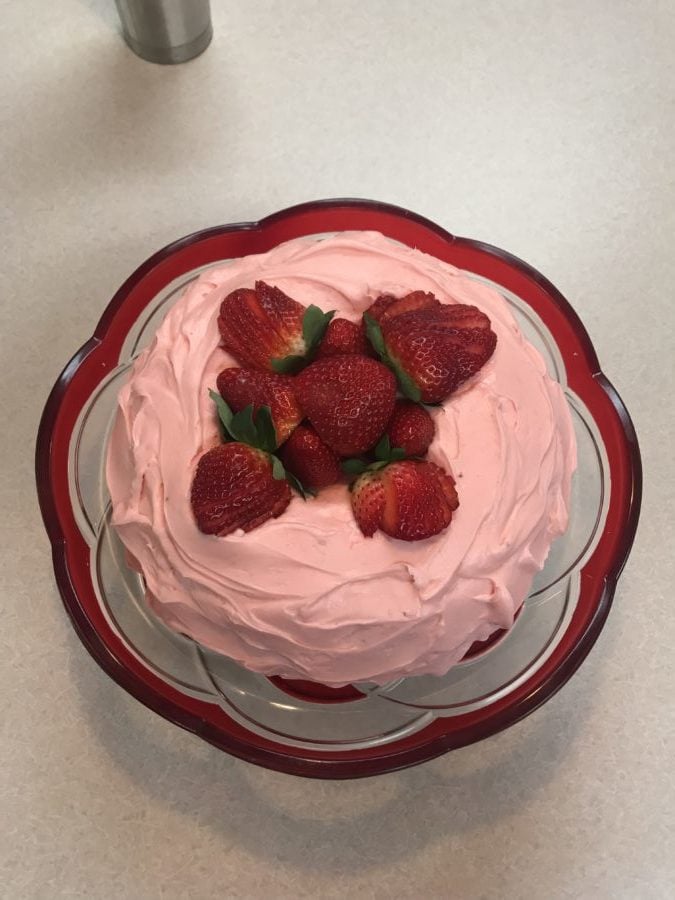 www.redneckrhapsody.com Strawberry Sensation Cake - Delish strawberry cake with strawberry cream cheese icing, and garnished with fresh strawberries.