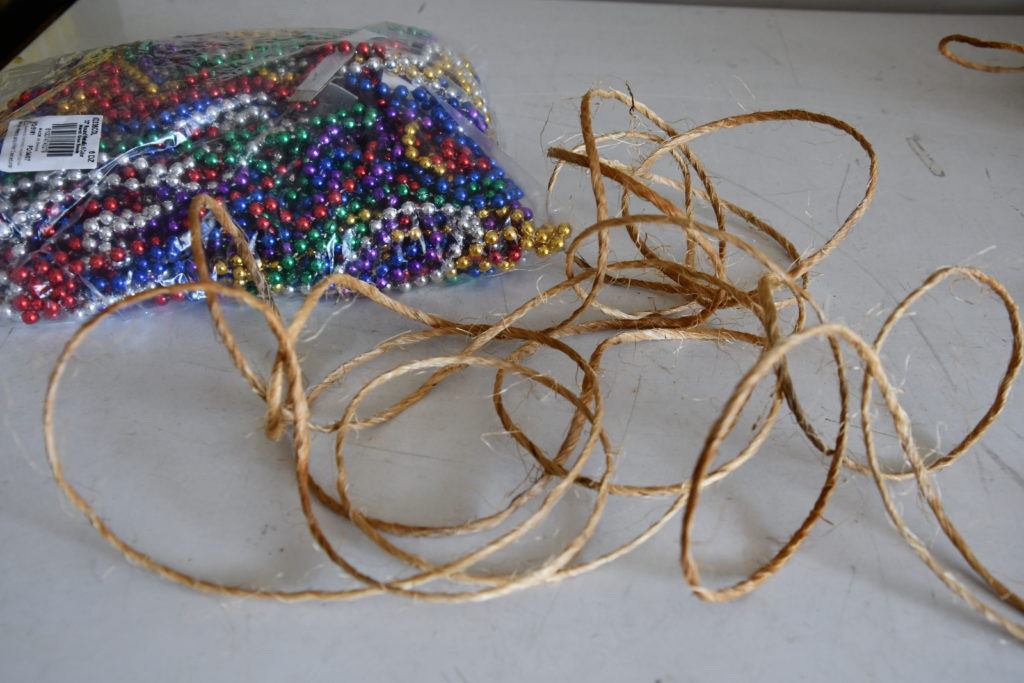 Twine and bag of Mardi Gras beads