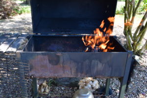 Grill is idea to use after flame dies down and coals are hot