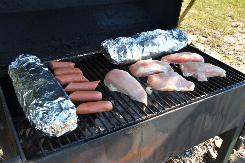 Grilling ideas: Smoked Sausage, chicken, bread, and squash on the grill.