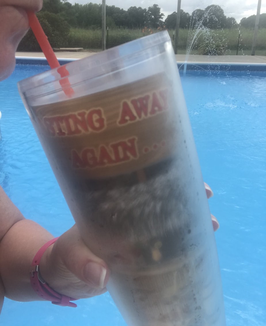 Sipping on something frozen on a hot sunny day.