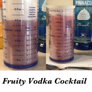 Fruity Vodka Cocktail in the making, measuring out the ingredients.