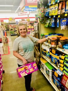 Shopping at Tractor Supply Co. for Friskies Cat food & treats.