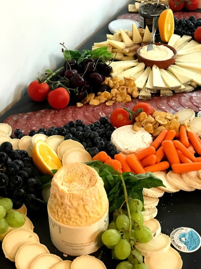 An amazing charcutrie display that was like 5 ft at Sweet Freedom Cheese. Fresh cheese, meats, fruits, veggies and condiments.