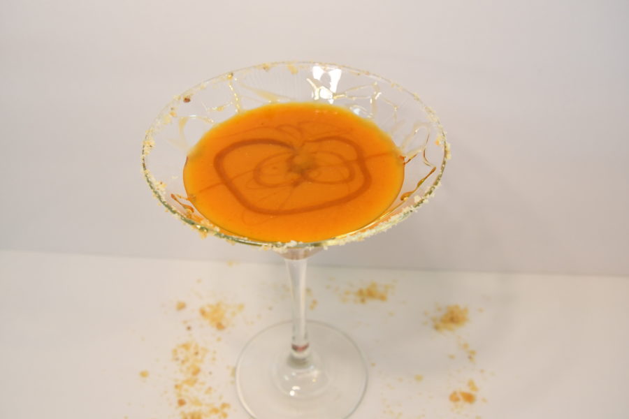 Martini glass with a Scrumptious Salted Caramel Pumpkintini in it.