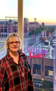 2020 focused on one of my 50/50 Trina in front of window with Texas Live & Rangers Stadium in background