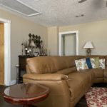 Sectional in family room, buffet with display and table
