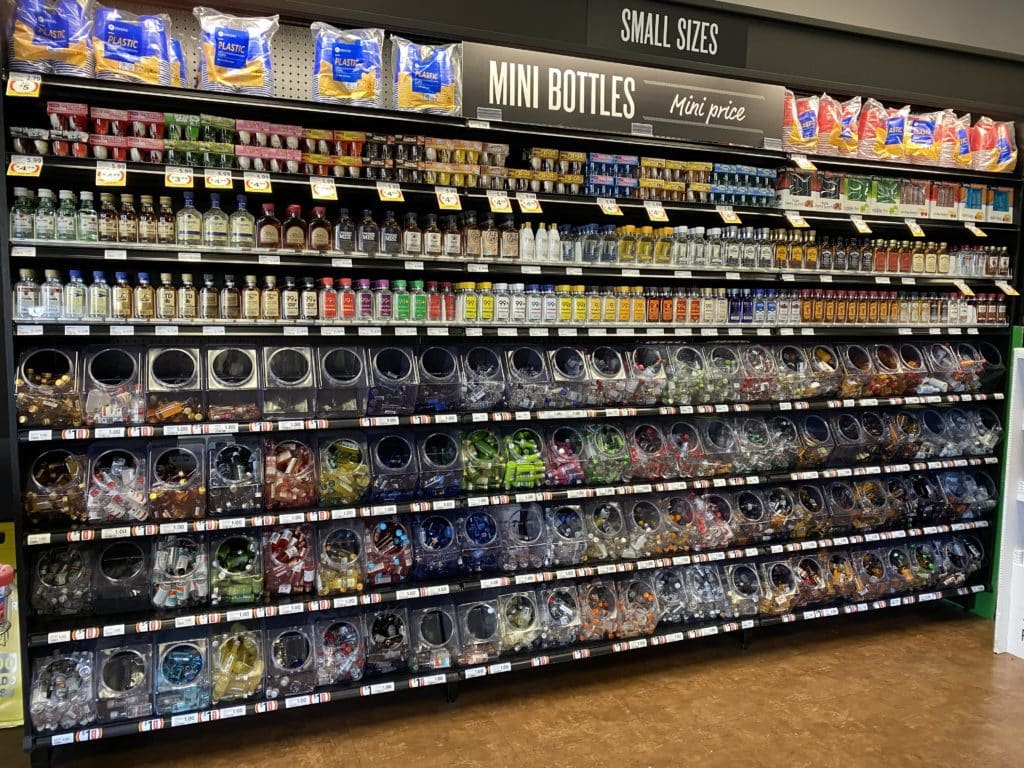 Epic cocktail recipes can be made from this wall of mini bottle of alcohol - hundreds of them.