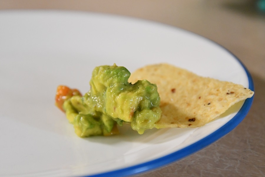 Healthy guacamole on chip ready to eat.