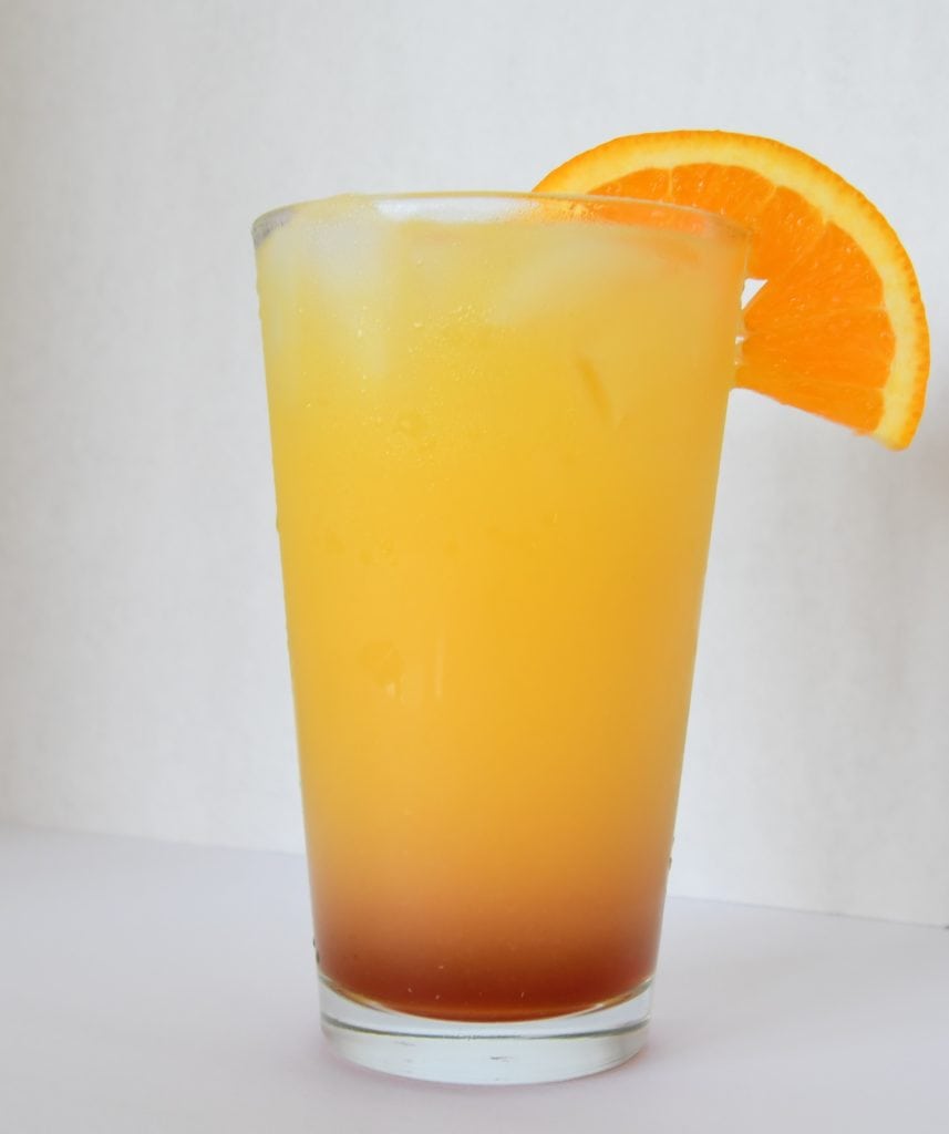 Delish Southern Tequila Sunset ready to sip, served up in a highball glass.