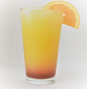 Delish Southern Tequila Sunset served up in a highball glass.