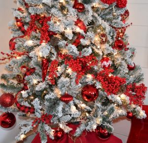 Decorating a flocked tree with red berries, balls and ribbons turned out gorgeous.
