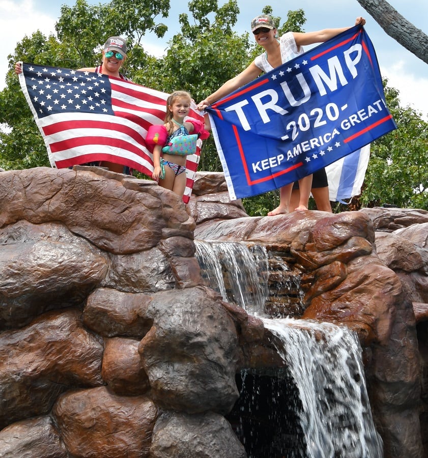 The girls holding American and Trump flags at Fason Falls